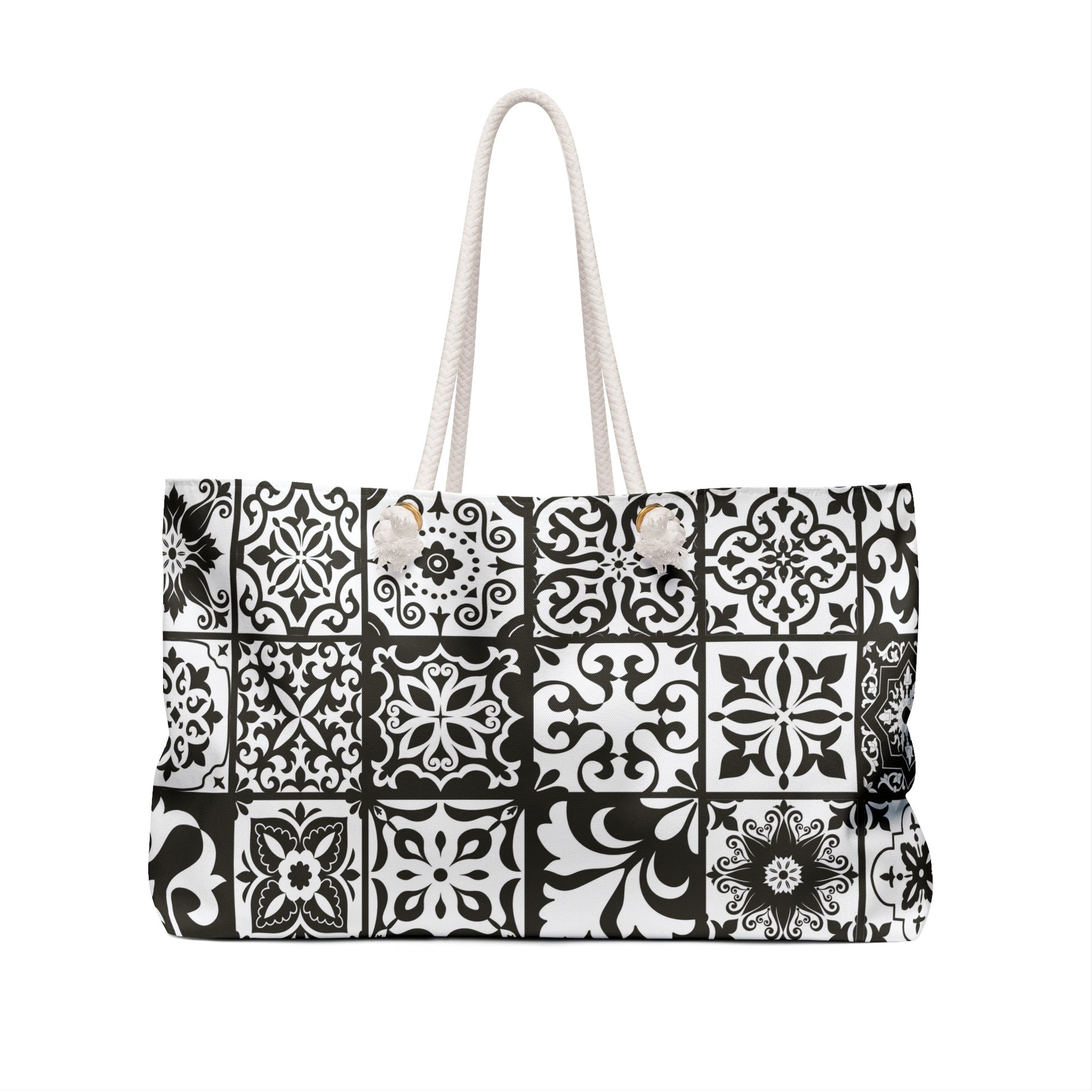 An oversized black and white Portuguese tile pattern tote bag with thick rope handles and a cream sheeting interior lining.