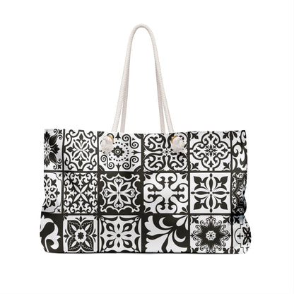An oversized black and white Portuguese tile pattern tote bag with thick rope handles and a cream sheeting interior lining.