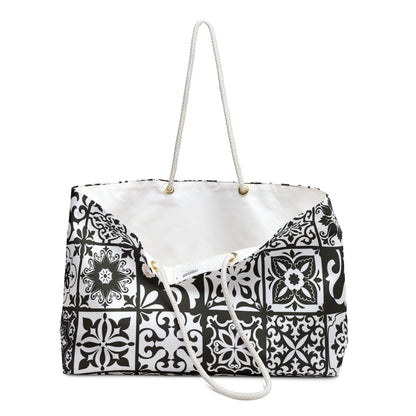 An oversized black and white Portuguese tile pattern tote bag with thick rope handles and a cream sheeting interior lining.