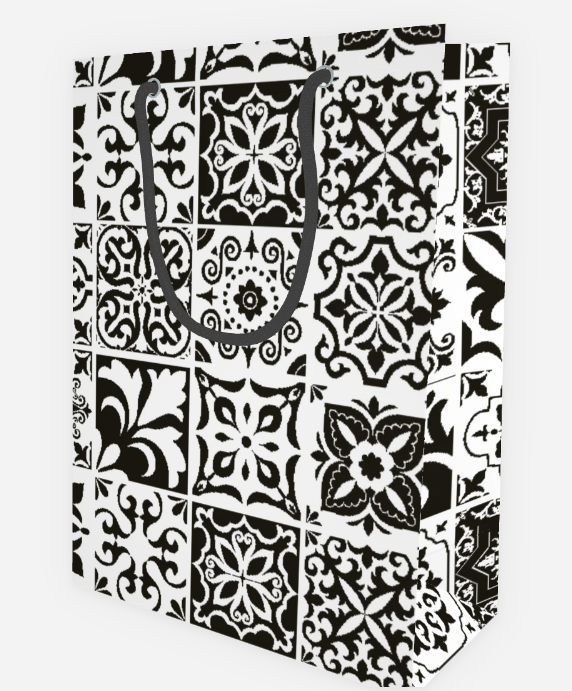 Black and white tile patterned gift bag on a white background