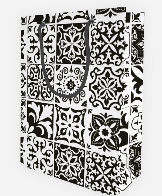 Black and white tile patterned gift bag on a white background