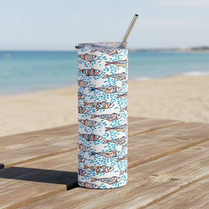Tumbler with geometric pattern and straw on a white background