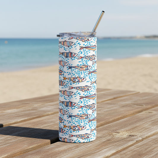 Tumbler with geometric pattern and straw on a white background