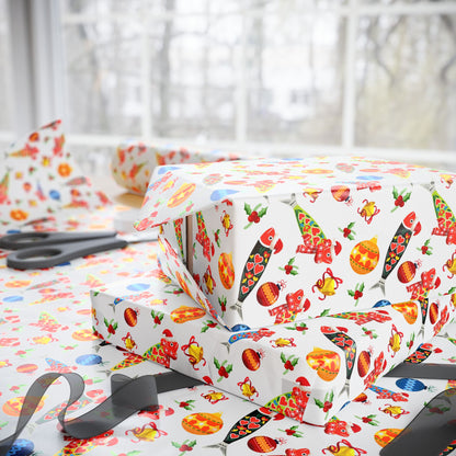 Gift box with colorful christmas sardine pattern on a matching wrapping paper with scissors beside it.