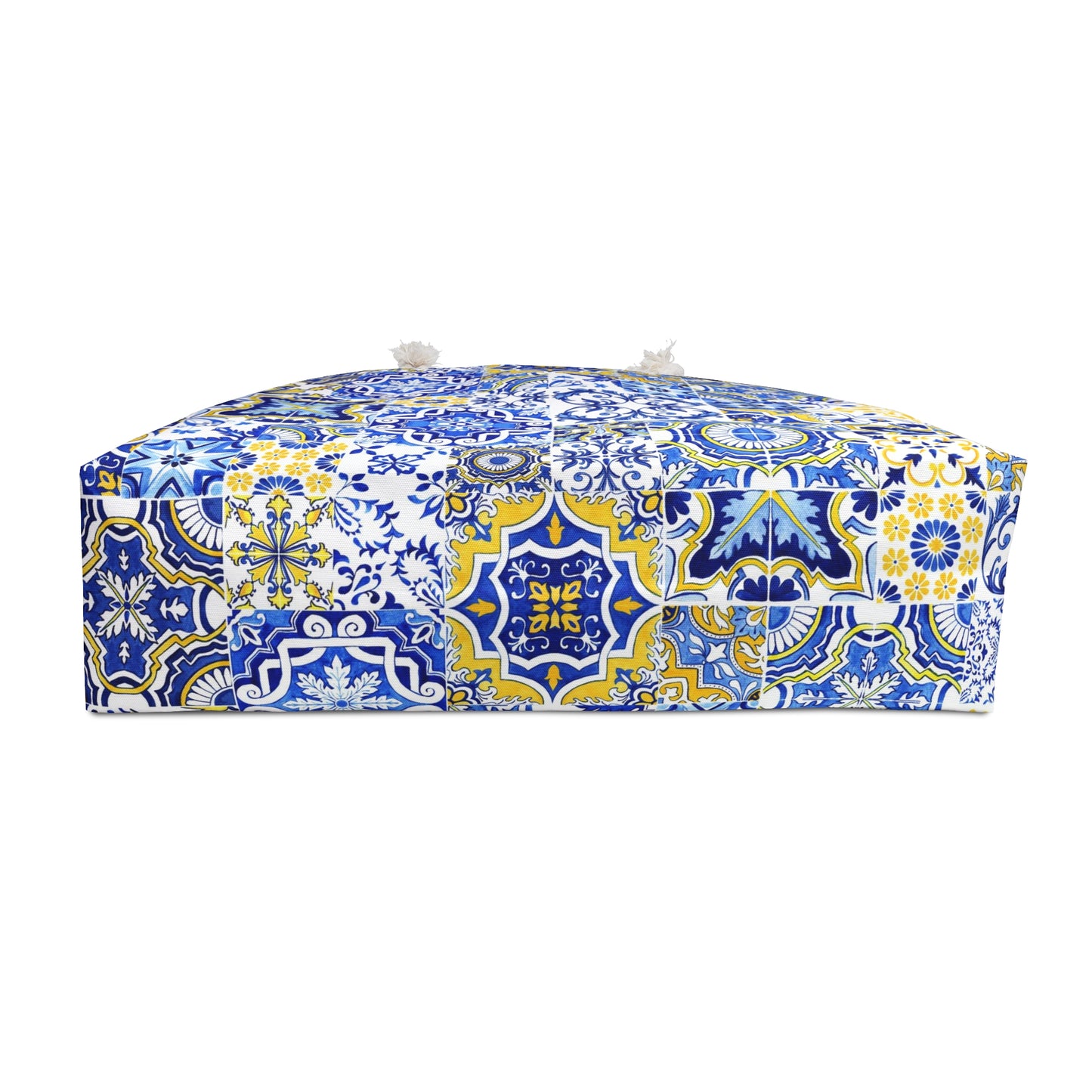 bottom of tote bag with blue and yellow pattern on a white background
