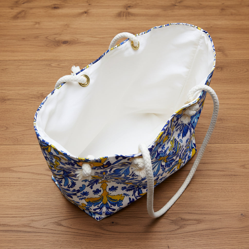 White drawstring bag with blue and yellow pattern on a wood background