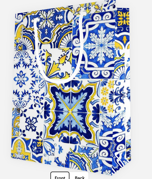 Blue and white patterned gift bag with floral and geometric designs.