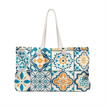Oversized tote bag with a vibrant green, blue, and yellow Portuguese tile print, featuring thick rope handles and a cream sheeting interior lining.