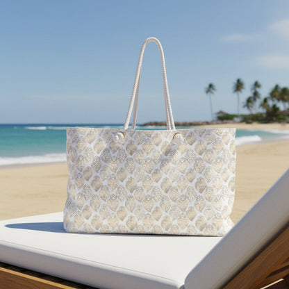 A cream-colored tote bag with a repeating pattern of light blue clouds, brown stars, and the words 'Rest well ea' in brown script. The bag has two white rope handles and is shown against a plain white background.