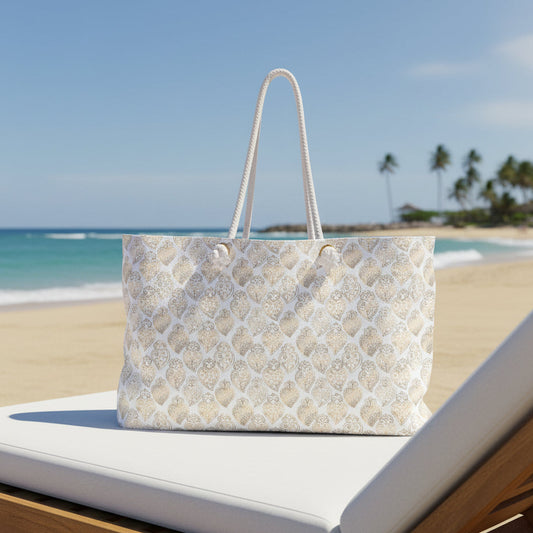 A cream-colored tote bag with a repeating pattern of light blue clouds, brown stars, and the words 'Rest well ea' in brown script. The bag has two white rope handles and is shown against a plain white background.