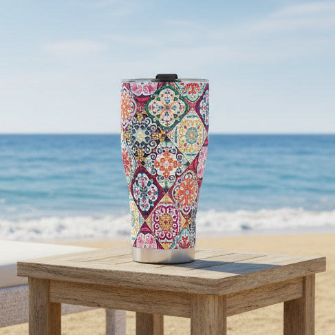 A stainless steel tumbler with a colorful Portuguese tile pattern design.