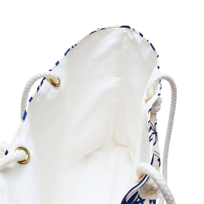 A large weekender tote bag with a blue and white Portuguese tile pattern and thick rope handles.