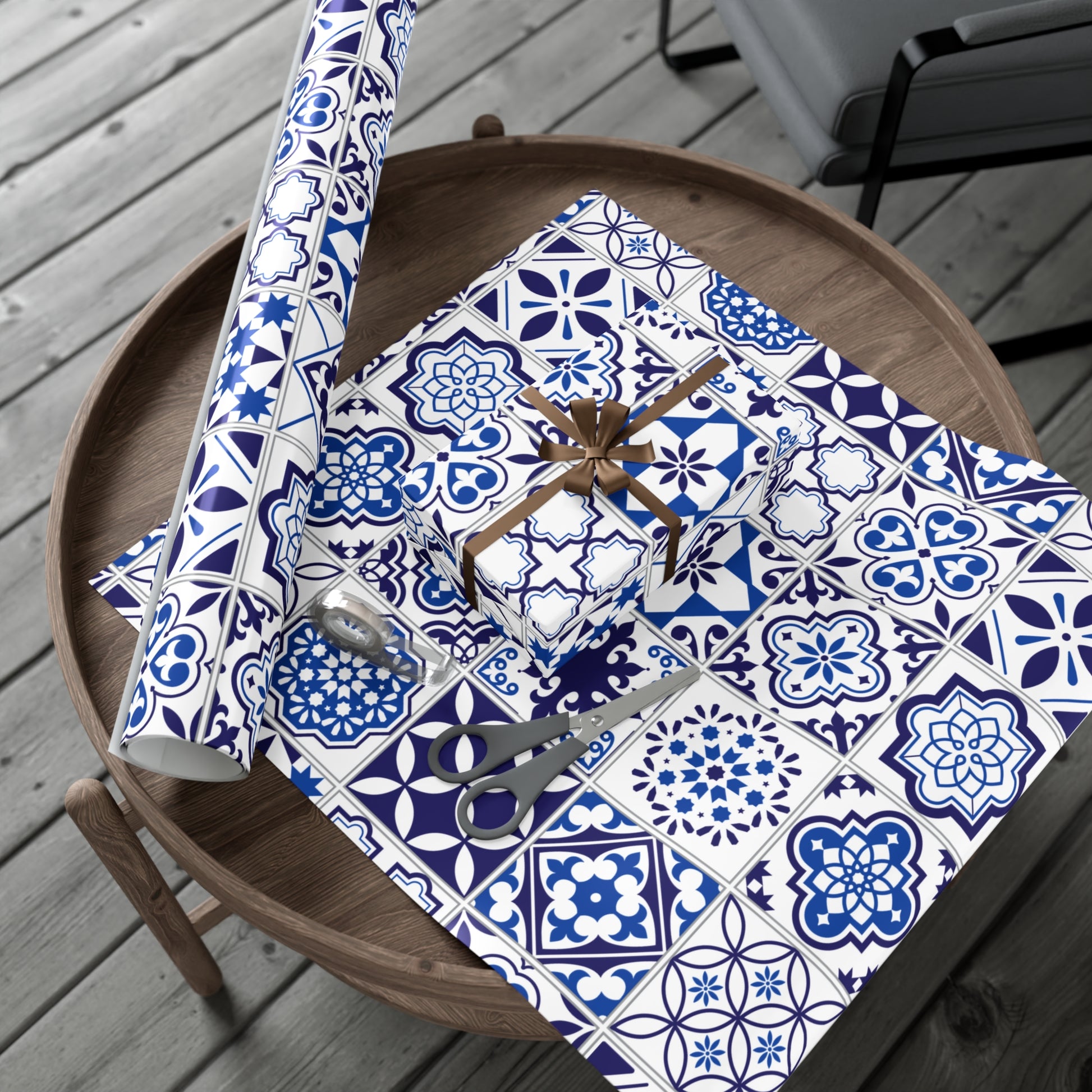 blue and white tile pattern giftwrap on a wooden table