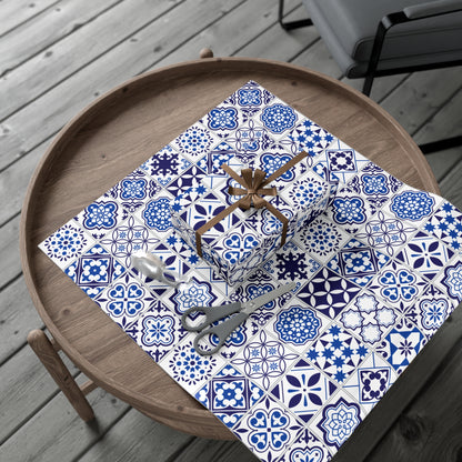 blue and white tile patterned paper with decorative items on a wooden surface.