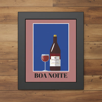 Framed wall art featuring a stylized wine bottle and glass on a blue background with the text 'BOA NOITE' below, set in a dark frame against a white background.