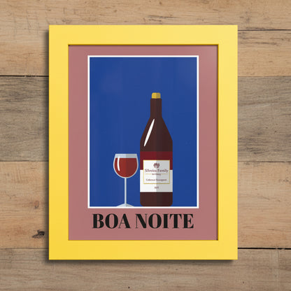 Framed wall art featuring a stylized wine bottle and glass on a blue background, with a mauve inner border and a bright yellow frame. The text 'BOA NOITE' appears at the bottom.