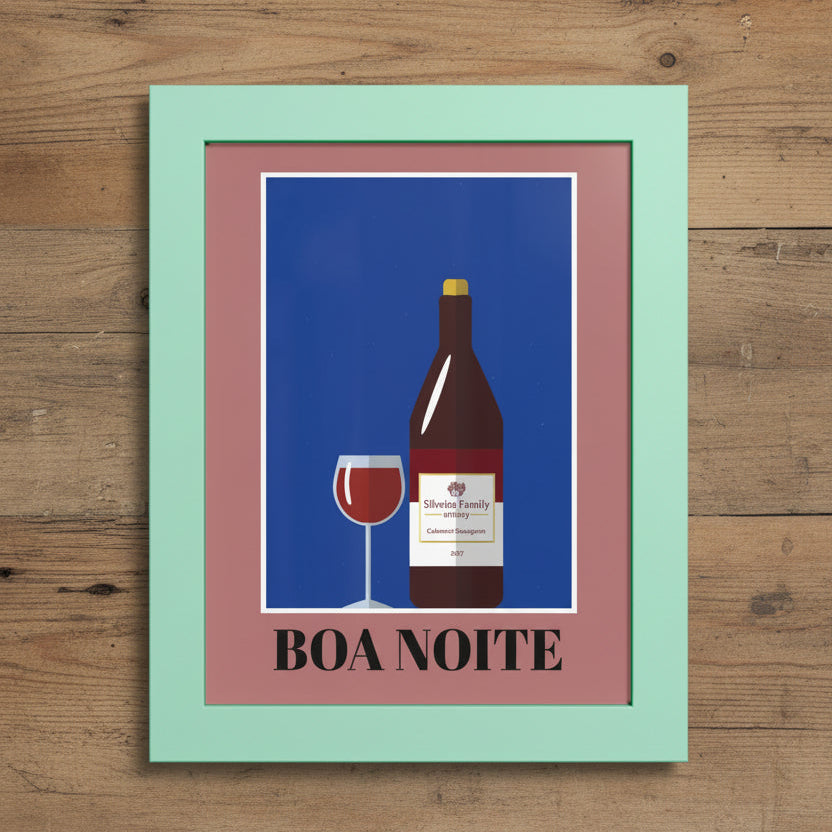 Framed wall art featuring a stylized wine bottle and wine glass on a blue background, with the text 'BOA NOITE' below. The print has a dusty pink inner border and a mint green outer frame, shown against a white background.