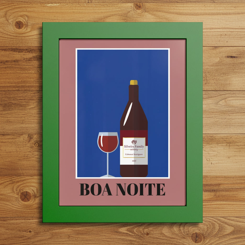 Framed wall art print featuring a stylized wine bottle and wine glass on a blue background, with the text 'BOA NOITE' below. The print has a dusty pink inner border and a green outer frame, shown against a plain white background.