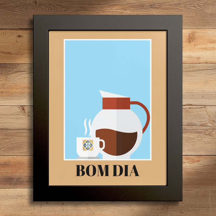 Framed wall art featuring a minimalist coffee-themed illustration with a white pitcher, a small cup, and the text 'BOM DIA' on a light blue background, surrounded by a tan mat and a dark frame.