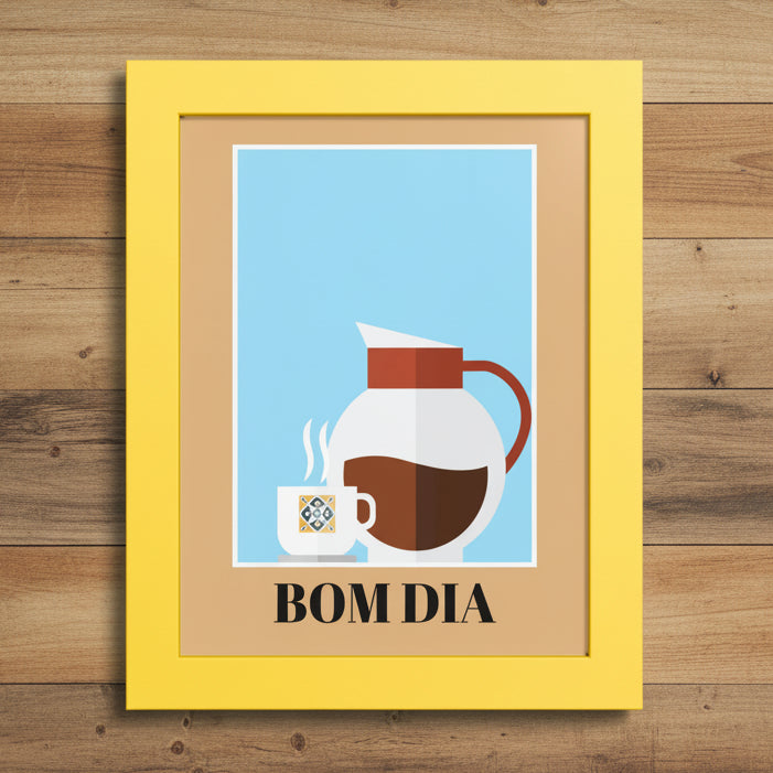 A framed art print with a bright yellow frame and a tan mat, featuring a minimalist illustration of a white coffee mug and a white coffee carafe with brown coffee against a light blue background, with the text 'BOM DIA' printed below.