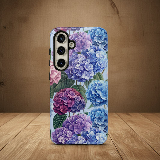 Phone case with a floral design featuring blue and pink hydrangeas on a white background
