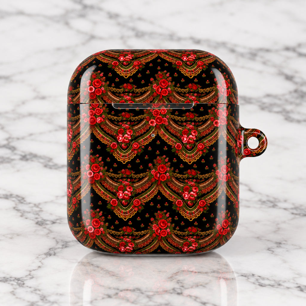 A protective case for wireless earbuds featuring an intricate red and gold traditional pattern on a black background, complete with a small hanging loop on the right side.