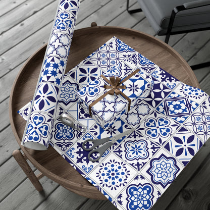 Rolls of blue and white patterned paper on a wooden table