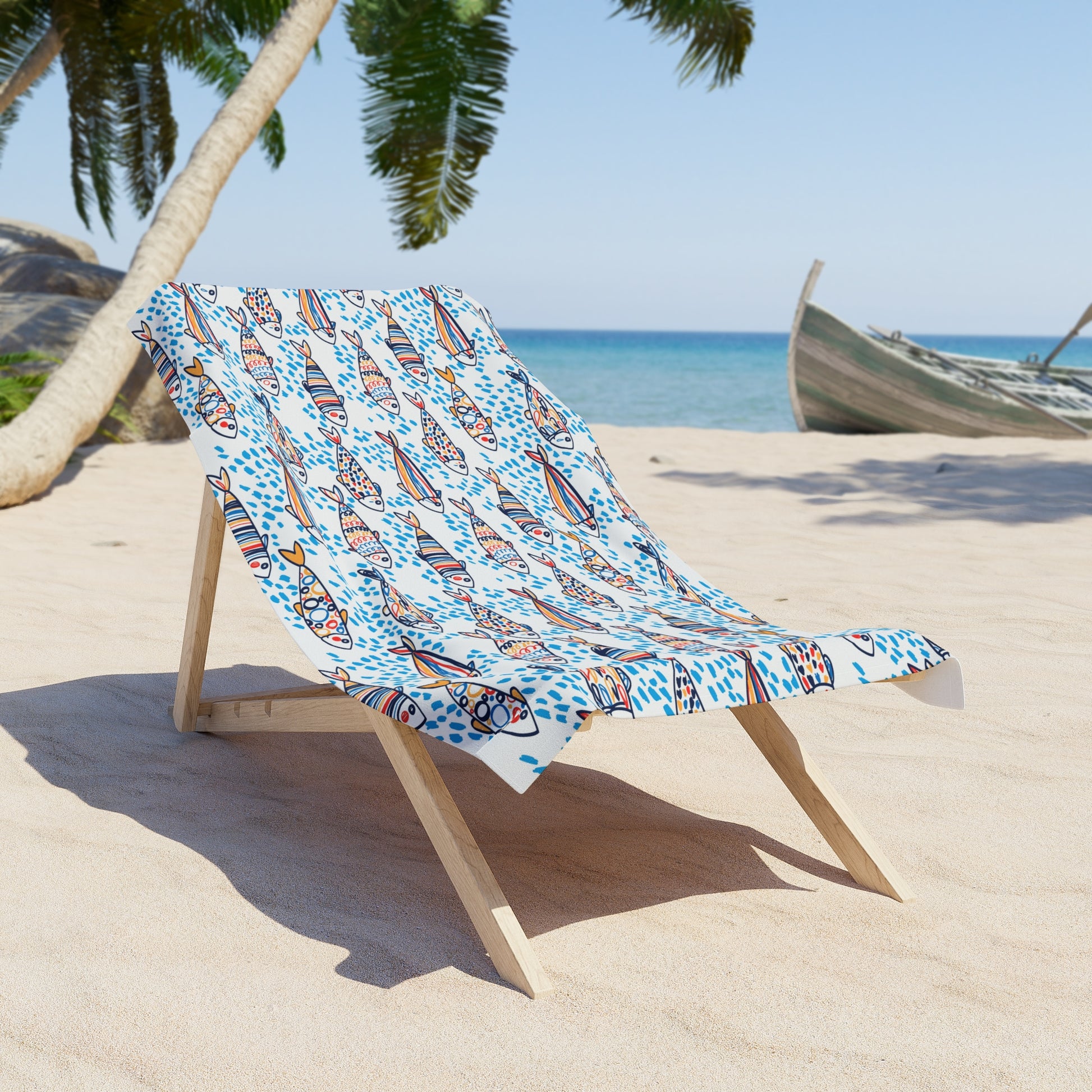 Beach chair with a colorful towel on a sandy beach with palm trees and a boat in the background.