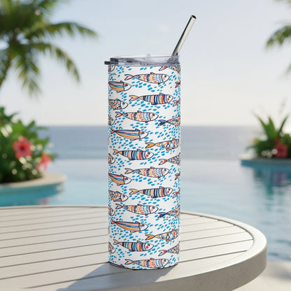 Tumbler with fish pattern and metal straw on a white background